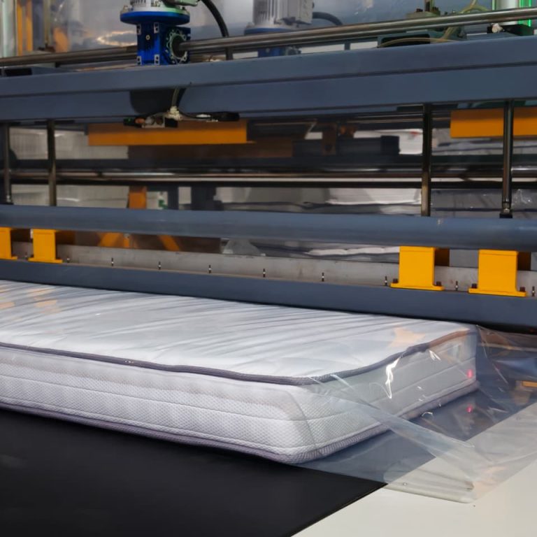 Finished mattress entering the final processing line