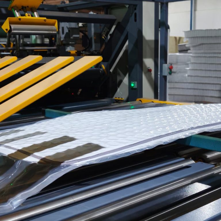 Quilted mattress panel prepared for assembly